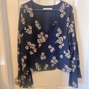 Cupcakes & Cashmere floral navy blue top with bell sleeves
